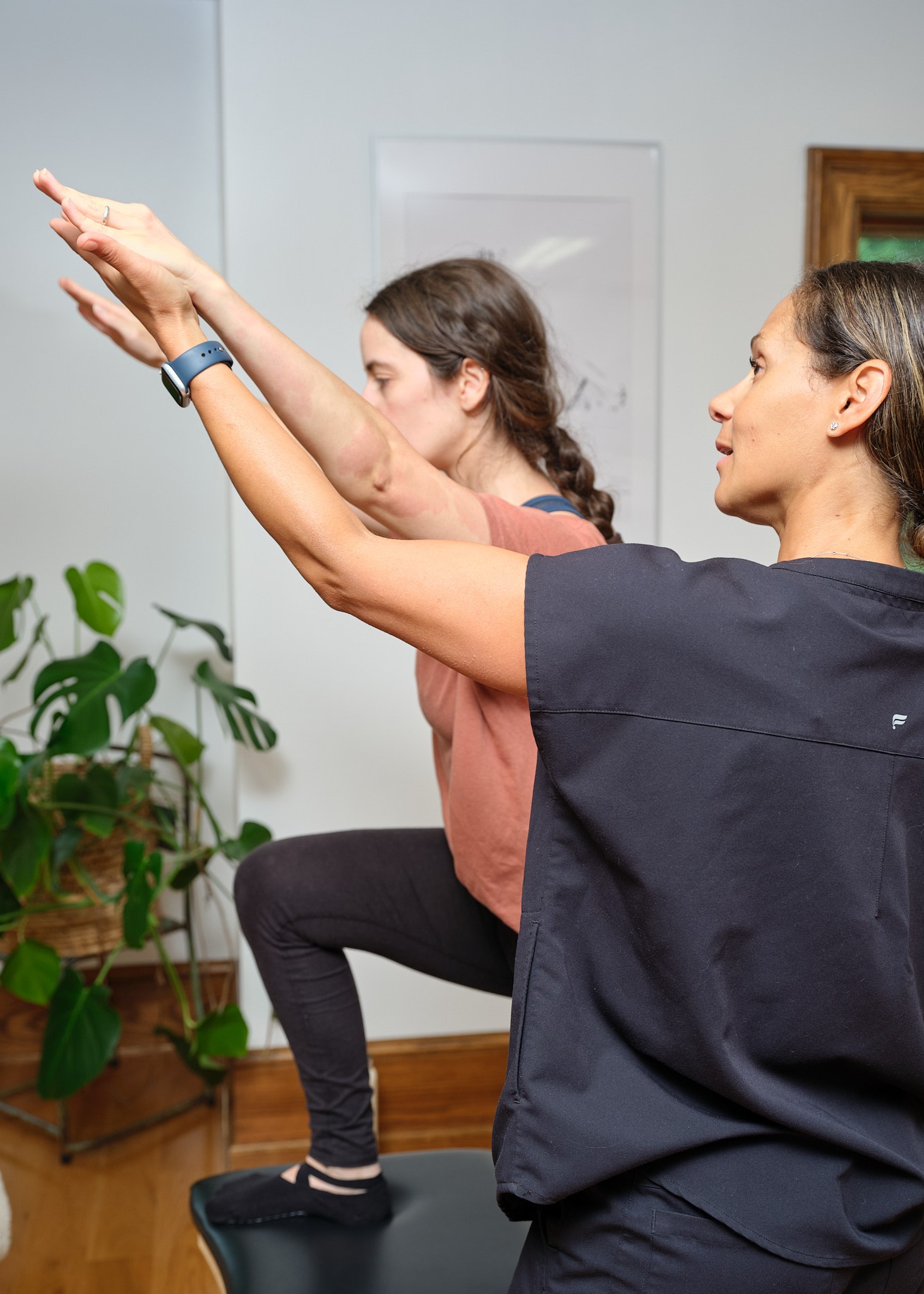 Alexandra, a Pilates instructor in Grand Rapids, demonstrating classical Pilates movements