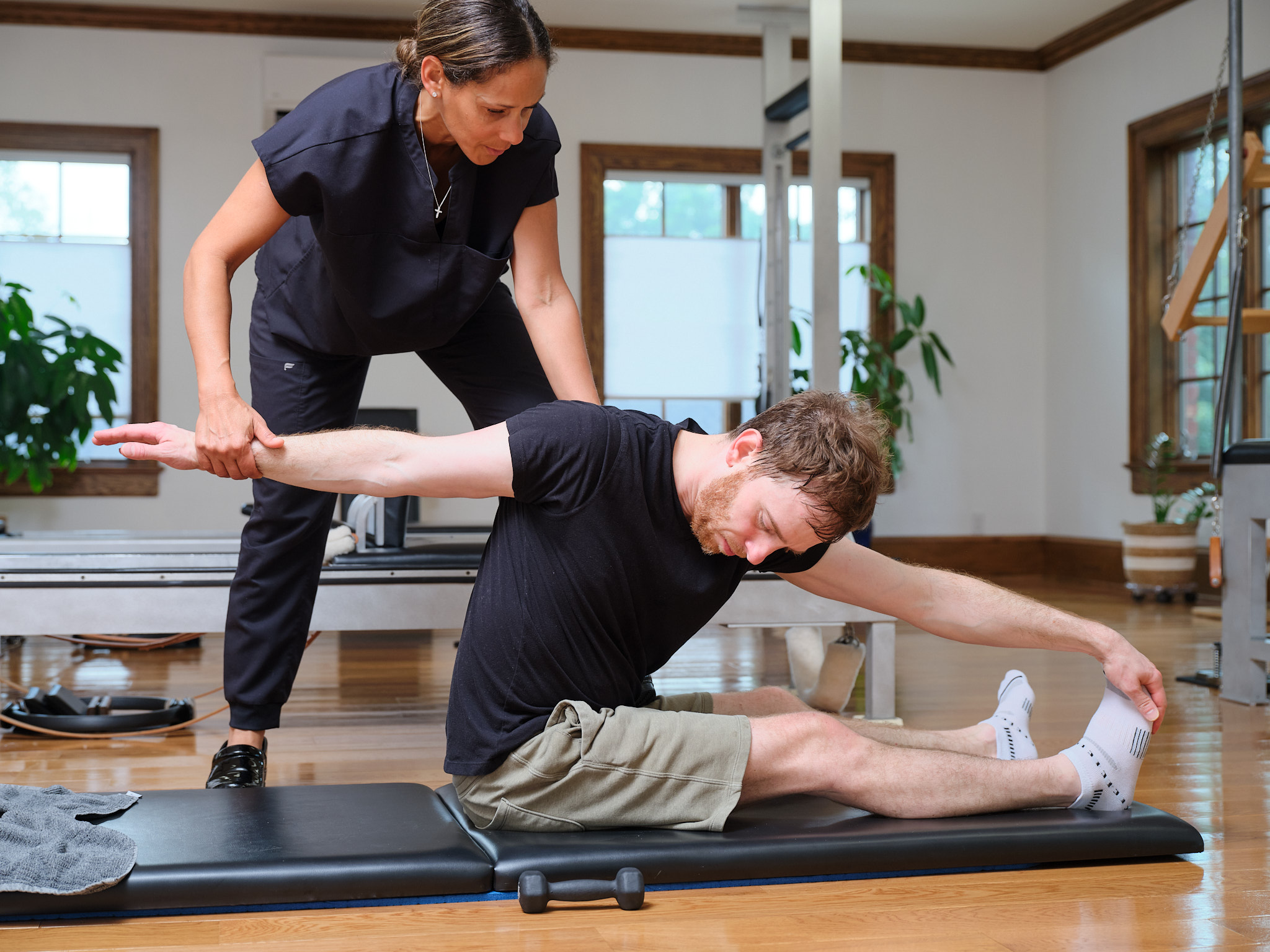Alexandra, a Pilates instructor in Grand Rapids, demonstrating classical Pilates movements