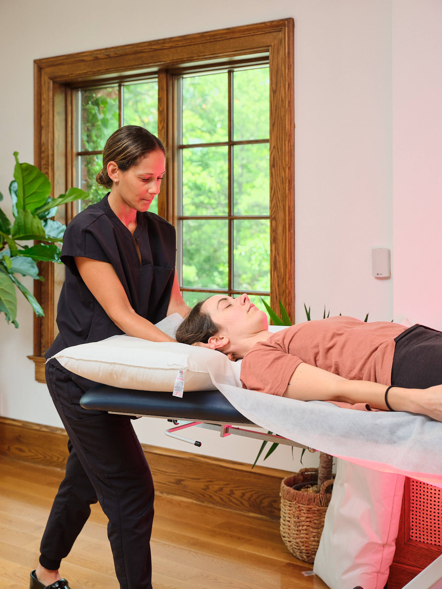 osteopathy-hands-on-treatment Alexandra, an osteopath in Grand Rapids, using hands-on osteopathic treatment on one of her patients